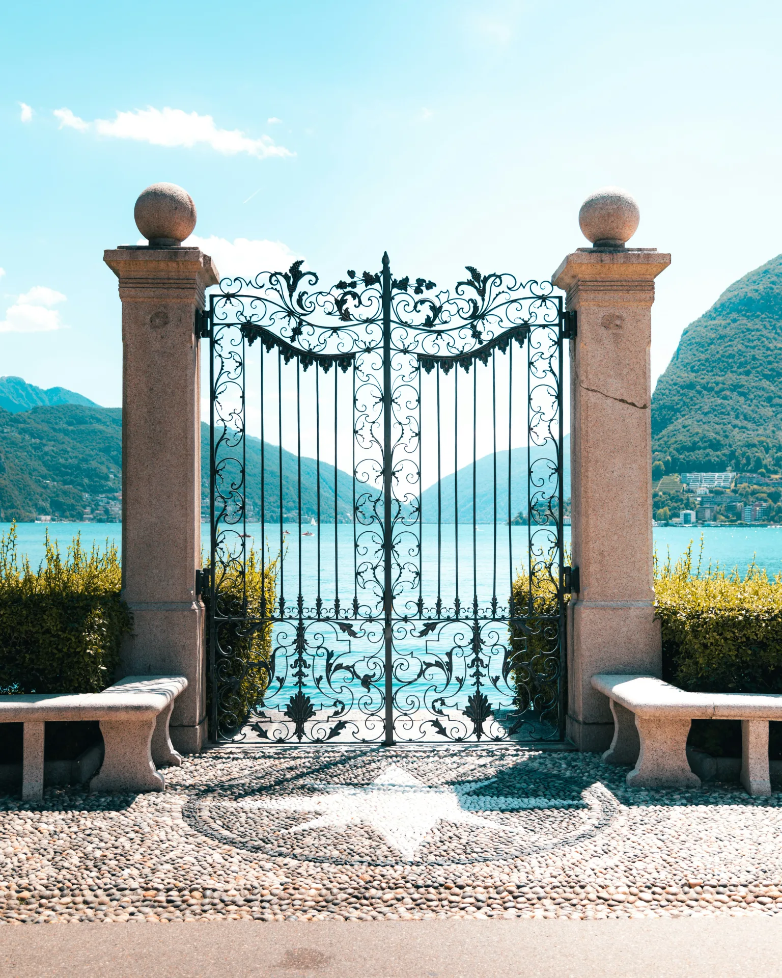 A forged gate next to the lake